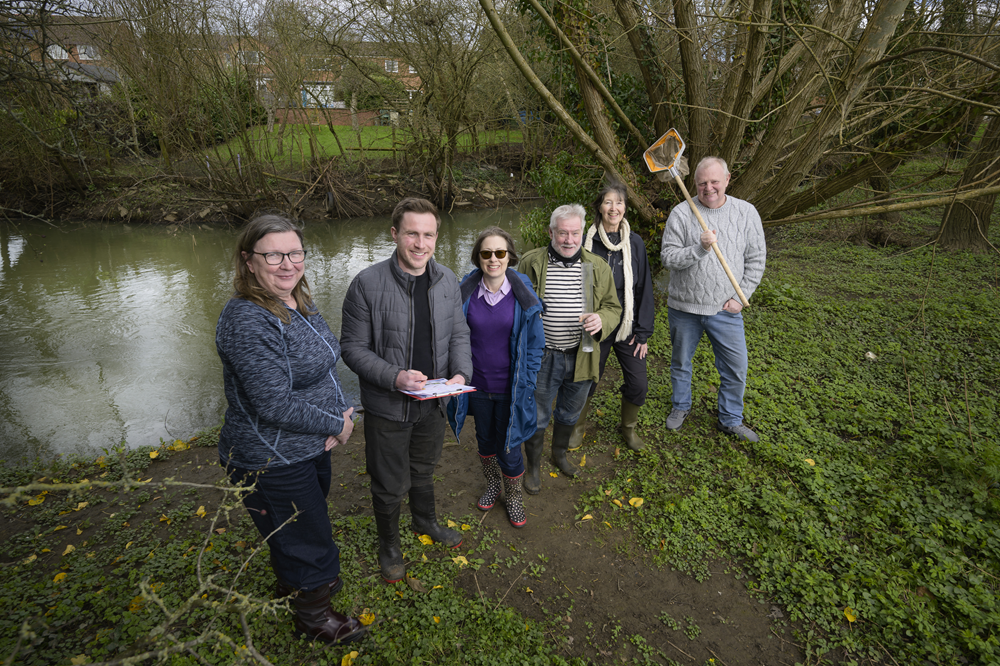 (L to R) Cllr Alison Livesey, Chair of the Rugby Borough Council Climate Emergency Working Group, and Dr James White, Birmingham River Champions founder and a Research Fellow in Water Sciences at the University of Birmingham, join Working Group member Cllr Isabelle McKenzie and River Champion volunteers Frank Green, Fern Hodges, and Cllr Tony Freeman.